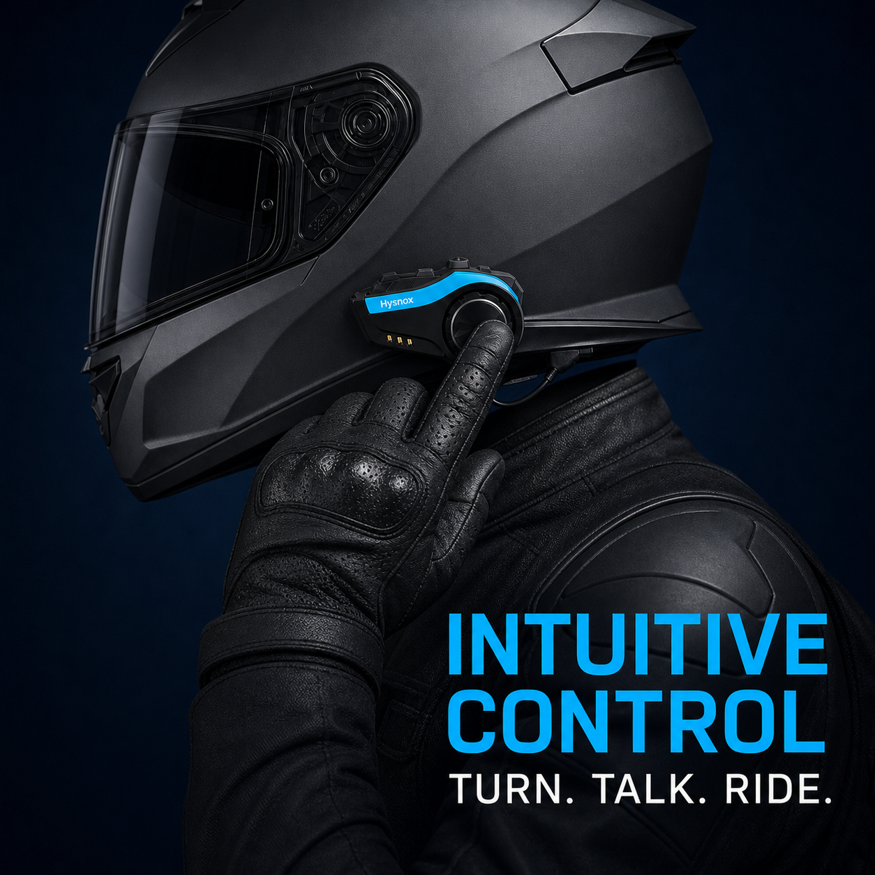 Gloved finger turning the control knob on a Hysnox motorcycle helmet intercom